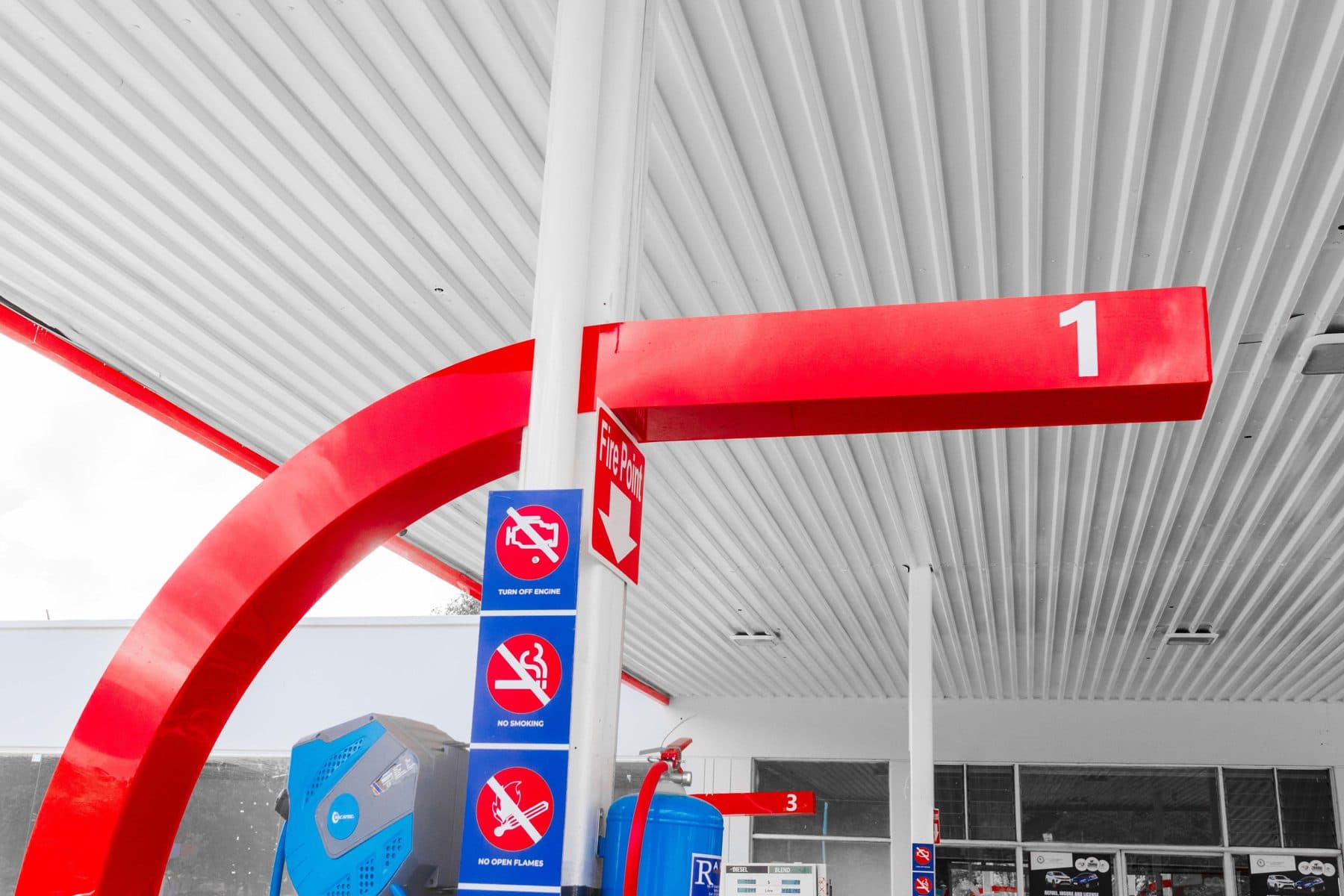 Red canopy arm meeting a white ceiling with crisp lines