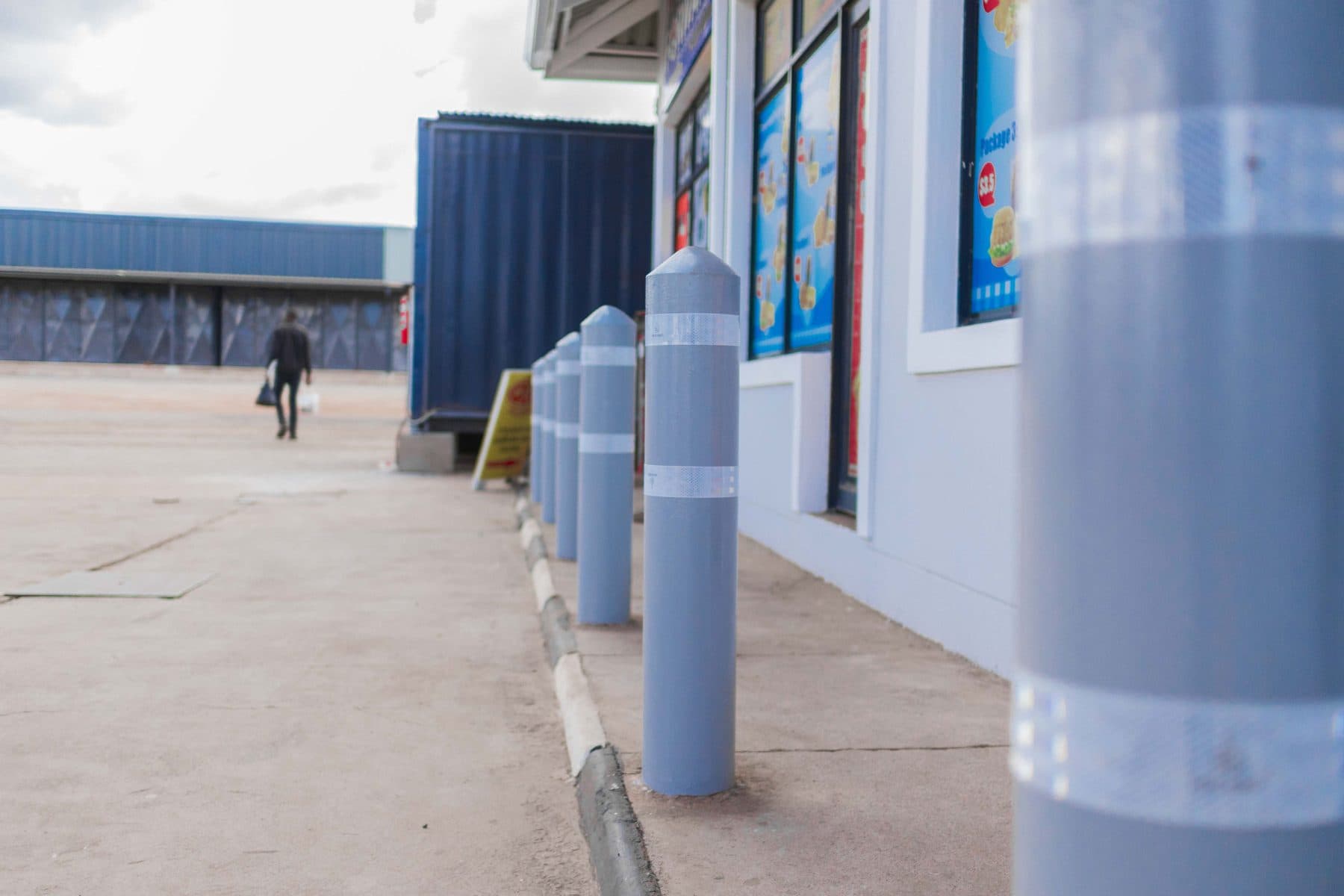 Finished shopfront with bollards and aluminium windows